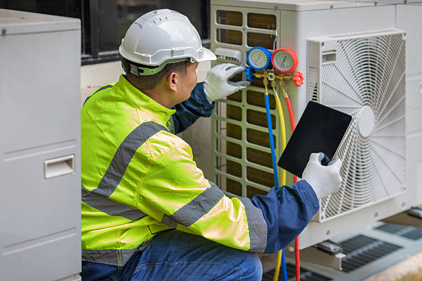 Professional Air Duct Cleaning technician working in Windsor, MO